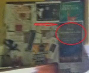 I know its a ridiculous blurry photo-but the circled poster says, "It's a wonderful life".